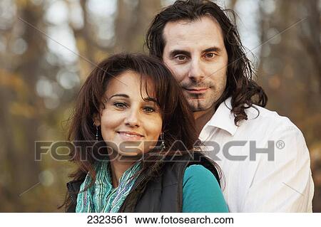 Portrait of a couple in a park in autumn; Edmonton alberta canada View Large Photo Image Stock Image - Portrait of a couple in a park in autumn; Edmonton alberta canada. Fotosearch