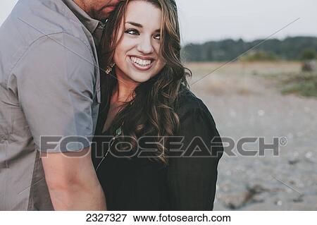 Stock Photo - Portrait of a couple on a beach; White rock british columbia canada. Fotosearch