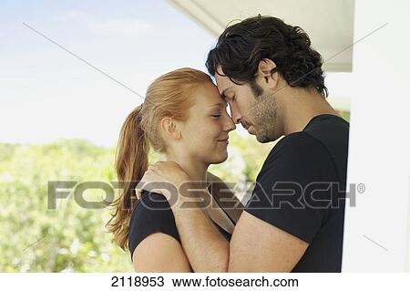 Stock Image - Portrait Of A Man And Woman In An Embrace; Wailua Kauai Hawaii United States Of America. Fotosearch