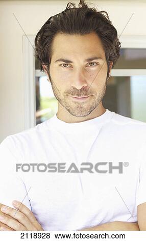 Stock Photo - Portrait Of A Man In A White T-Shirt; Wailua Kauai Hawaii United States Of America. Fotosearch