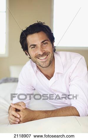 Portrait Of A Man Relaxing On A Bed; Wailua Kauai Hawaii United States Of America View Large Photo Image Stock Photo - Portrait Of A Man Relaxing On A Bed; Wailua Kauai Hawaii United States Of America. Fotosearch