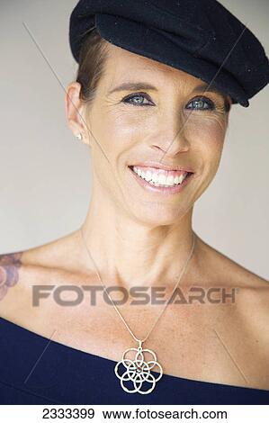 Stock Photo - Portrait of a middle aged woman; Kauai hawaii united states of america. Fotosearch