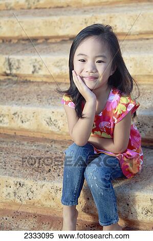 Portrait of a young girl sitting on steps; Honolulu oahu hawaii united states of america View Large Photo Image Stock Photography - Portrait of a young girl sitting on steps; Honolulu oahu hawaii united states of america. Fotosearch