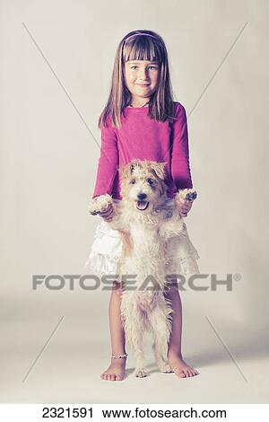 Portrait Of A Young Girl With Her Dog Standing On It's Hind Legs; Malaga Andalusia Spain View Large Photo Image Stock Image - Portrait Of A Young Girl With Her Dog Standing On It's Hind Legs; Malaga Andalusia Spain. Fotosearch