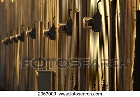 Power Meters On Metal Boathouses At Sunset, Sidney, Bc, Canada View Large Photo Image Stock Photo - Power Meters On Metal Boathouses At Sunset, Sidney, Bc, Canada. Fotosearch