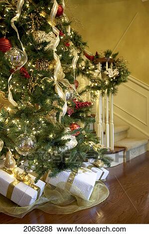 Presents Under A Christmas Tree At The Base Of A Staircase, Canada, Ontario View Large Photo Image Stock Photo - Presents Under A Christmas Tree At The Base Of A Staircase, Canada, Ontario. Fotosearch
