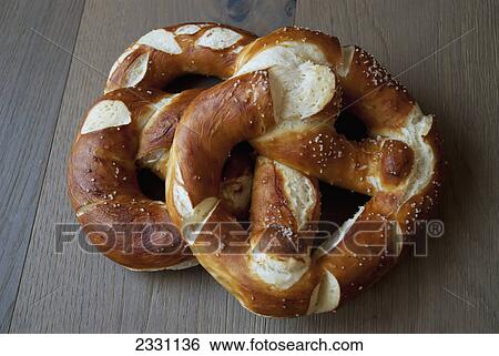 Stock Photograph - Pretzels on a wooden table; Zermatt valais switzerland. Fotosearch