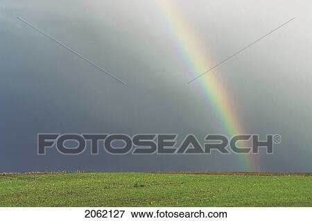 Stock Photo - Rainbow, Rural Manitoba, Canada. Fotosearch