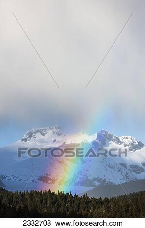 Rainbows and intermittent showers in tongass national forest with herbert glacier beyond amalga harbor area in spring; Juneau alaska united states of america View Large Photo Image Stock Photo - Rainbows and intermittent showers in tongass national forest with herbert glacier beyond amalga harbor area in spring; Juneau alaska united states of america. Fotosearch