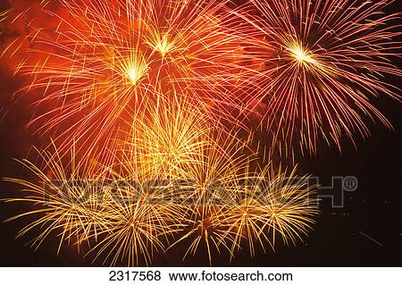 Stock Photo - Red And Yellow Fireworks; Vancouver British Columbia Canada. Fotosearch