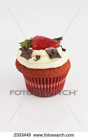 Red velvet cupcake with icing garnished with chocolate and a strawberry on a white background; Hawaii united states of america View Large Photo Image Stock Photo - Red velvet cupcake with icing garnished with chocolate and a strawberry on a white background; Hawaii united states of america. Fotosearch
