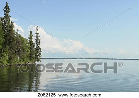 Reflection In Clear Lake, Riding Mountain National Park, Manitoba, Canada View Large Photo Image Stock Photography - Reflection In Clear Lake, Riding Mountain National Park, Manitoba, Canada. Fotosearch