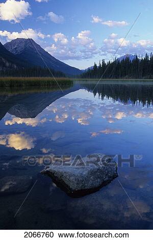 Reflection Of A Mountain In A Lake Enroute To The Historic Athabasca Pass In Jasper National Park View Large Photo Image Stock Image - Reflection Of A Mountain In A Lake Enroute To The Historic Athabasca Pass In Jasper National Park. Fotosearch