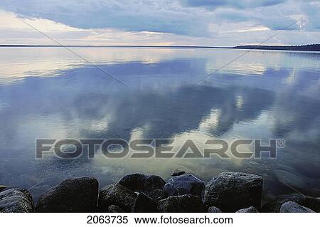 Reflection Of Clouds In Clear Lake; Canada, Manitoba, Riding Mountain National Park View Large Photo Image Stock Photography - Reflection Of Clouds In Clear Lake; Canada, Manitoba, Riding Mountain National Park. Fotosearch