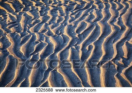 Stock Photo - Ripples in the sand at derrynane beach; County kerry ireland. Fotosearch