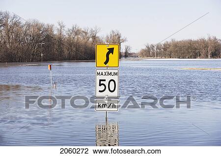 Road Sign Is Rather Pointless Now That The Road Is Covered With Floowater From The Red River, Rural Manitoba View Large Photo Image Stock Image - Road Sign Is Rather Pointless Now That The Road Is Covered With Floowater From The Red River, Rural Manitoba. Fotosearch