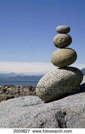 Stock Photo - Rocks Stacked On Beach, English Bay, Vancouver Bc. Fotosearch