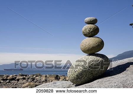 Stock Photo - Rocks Stacked On Beach, English Bay, Vancouver Bc. Fotosearch