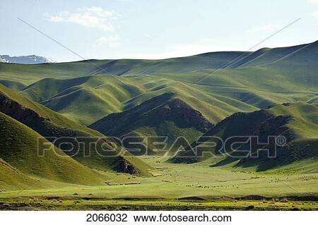 Stock Image - Rolling Green Hills, Kyrgyzstan. Fotosearch