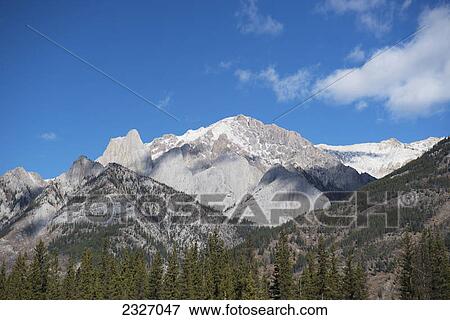 Rugged canadian rocky mountains in banff national park; Alberta canada View Large Photo Image Stock Photo - Rugged canadian rocky mountains in banff national park; Alberta canada. Fotosearch