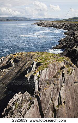 Stock Photo - Rugged rocks along the coast in dunmanus bay near durrus; County cork ireland. Fotosearch