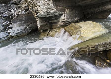 Rushing river cascading over rocks in the noatak river in the brooks range gates of the arctic national park northwestern alaska; Alaska united states of america View Large Photo Image Stock Photograph - Rushing river cascading over rocks in the noatak river in the brooks range gates of the arctic national park northwestern alaska; Alaska united states of america. Fotosearch