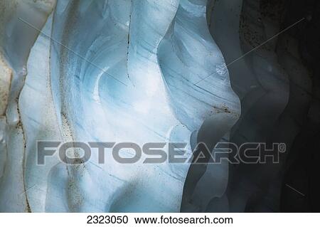 Scalloped ice inside an ice cave showing colored veins in the ice jasper national park; Alberta canada View Large Photo Image Stock Image - Scalloped ice inside an ice cave showing colored veins in the ice jasper national park; Alberta canada. Fotosearch