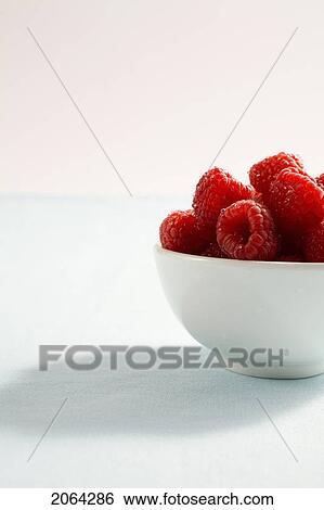 Stock Photograph - Side View, Bowl Of Raspberries. Fotosearch