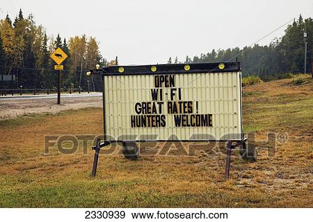 Stock Photo - Sign advertising accommodation hunters welcome; Ontario canada. Fotosearch