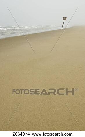 Sign On Flat Sandy Beach With Mist In The Background, Reedsport, Oregon View Large Photo Image Picture - Sign On Flat Sandy Beach With Mist In The Background, Reedsport, Oregon. Fotosearch