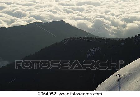 Silhouette Of A Skier Above The Clouds With Mountain Ridges In The Background, Mount Arrowsmith, Port Alberni, Bc View Large Photo Image Stock Image - Silhouette Of A Skier Above The Clouds With Mountain Ridges In The Background, Mount Arrowsmith, Port Alberni, Bc. Fotosearch