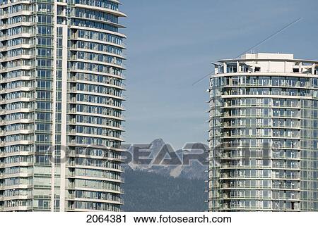 Stock Image - Skyscrapers Occupy The Vancouver Skyline. Housing Prices Are At An All-Time High. Fotosearch