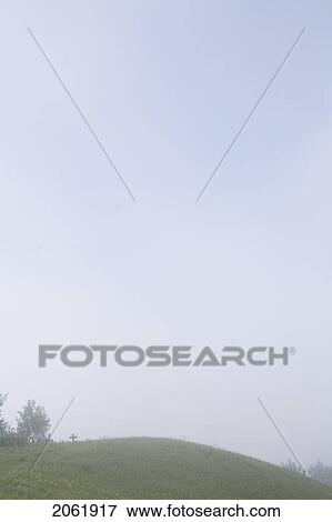 Small Cross At Crest Of Hill In Mist, Saskatchewan, Canada View Large Photo Image Stock Photo - Small Cross At Crest Of Hill In Mist, Saskatchewan, Canada. Fotosearch