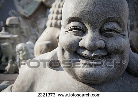 Smiling Stone Buddha Statue; Beijing China View Large Photo Image Stock Image - Smiling Stone Buddha Statue; Beijing China. Fotosearch