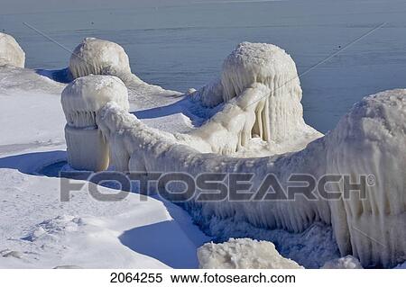Stock Photography - Snow And Ice Covered Fence Along Lake Ontario, Burlington, Ontario.. Fotosearch