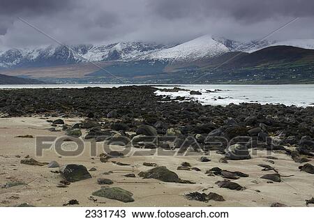Snow covered mountains near fermoyle strand; County kerry ireland View Large Photo Image Stock Image - Snow covered mountains near fermoyle strand; County kerry ireland. Fotosearch