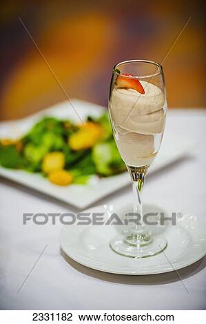 Stock Image - Sorbet in glass stemware; United states of america. Fotosearch