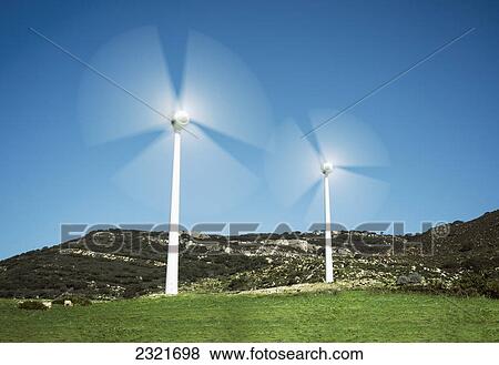 Stock Photo - Spinning Wind Turbines; Tarifa Cadiz Andalusia Spain. Fotosearch