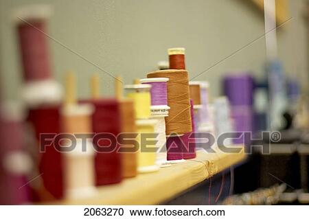 Spools Of Thread Lined Along The Wall On A Shelf, Canada, Ontario View Large Photo Image Stock Image - Spools Of Thread Lined Along The Wall On A Shelf, Canada, Ontario. Fotosearch