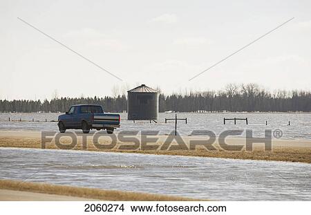 Spring Floodwater Of Red River Come Close To Covering Highway View Large Photo Image Picture - Spring Floodwater Of Red River Come Close To Covering Highway. Fotosearch