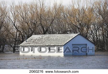 Stock Photograph - Spring Floodwater Of Red River In Farmyard, Rural Manitoba. Fotosearch
