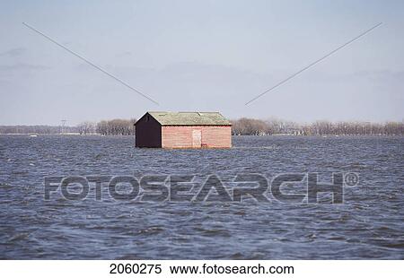 Stock Photography - Spring Floodwater Of Red River In Farmyard, Rural Manitoba. Fotosearch