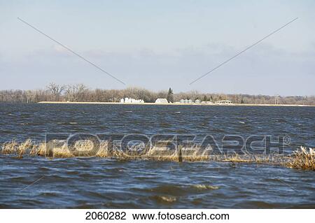 Spring Floodwaters Of The Red River Make An Island Of A Framyard, Rural Manitoba View Large Photo Image Stock Image - Spring Floodwaters Of The Red River Make An Island Of A Framyard, Rural Manitoba. Fotosearch