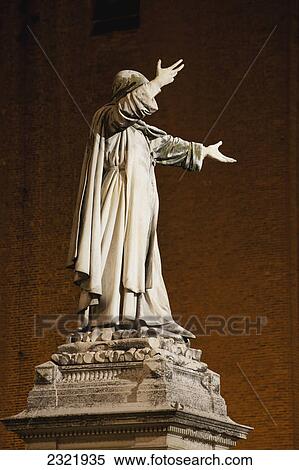 Stock Photography - Statue Of The Duke Nicolo Iii Lit At Night With Brick Wall Of Castle In The Background; Ferrara Emilia-Romagna Italy. Fotosearch
