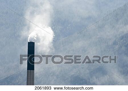 Steam Comes From A Smokestack At A Smelter In Bc View Large Photo Image Stock Image - Steam Comes From A Smokestack At A Smelter In Bc. Fotosearch
