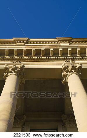 Stock Image - Stone Architectural Detail On A Building Against A Blue Sky; Edmonton Alberta Canada. Fotosearch