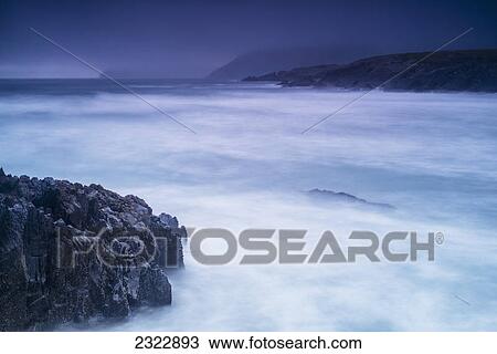 Stock Image - Stormy evening in st finan's bay; County kerry ireland. Fotosearch
