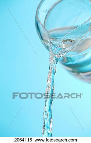 Stock Photography - Stream Of Water Being Poured From A Pitcher. Fotosearch