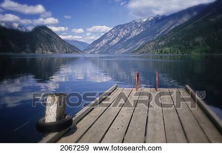 Summer At Anderson Lake, With The Old Dock In Foreground, B. C. View Large Photo Image Stock Photo - Summer At Anderson Lake, With The Old Dock In Foreground, B. C.. Fotosearch