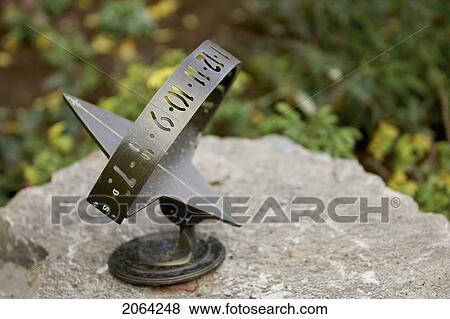 Sundial On Rock, Burlington, Ontario. View Large Photo Image Stock Photo - Sundial On Rock, Burlington, Ontario.. Fotosearch